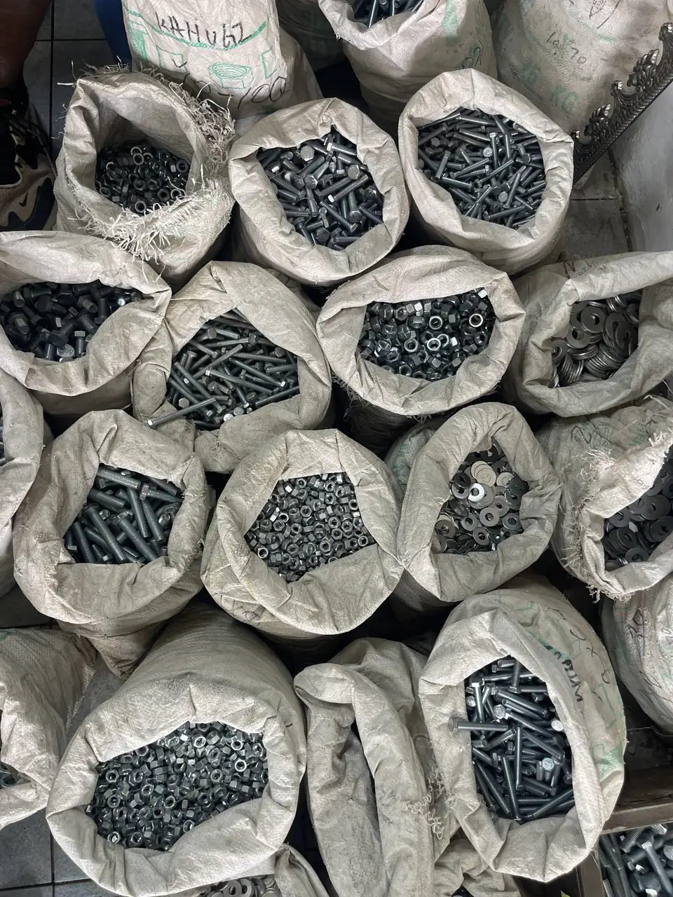 Sacks of fastening hardware in a Kenya supply shop