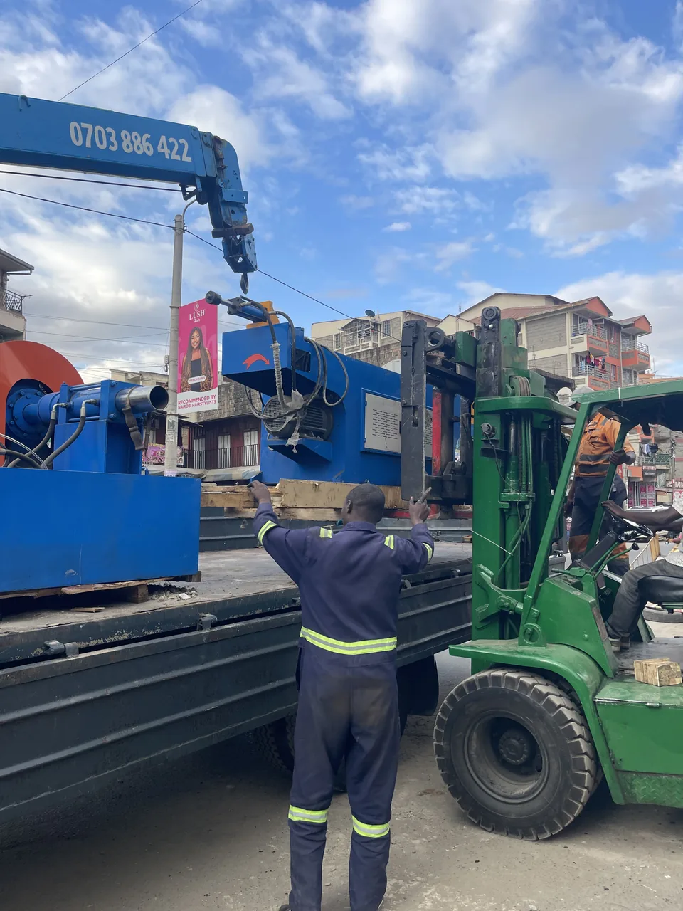 Blue equipment being loaded for a stock run in Kenya