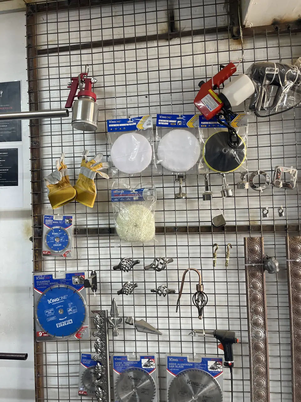Workshop tools arranged on a wall in a Kenya supply shop